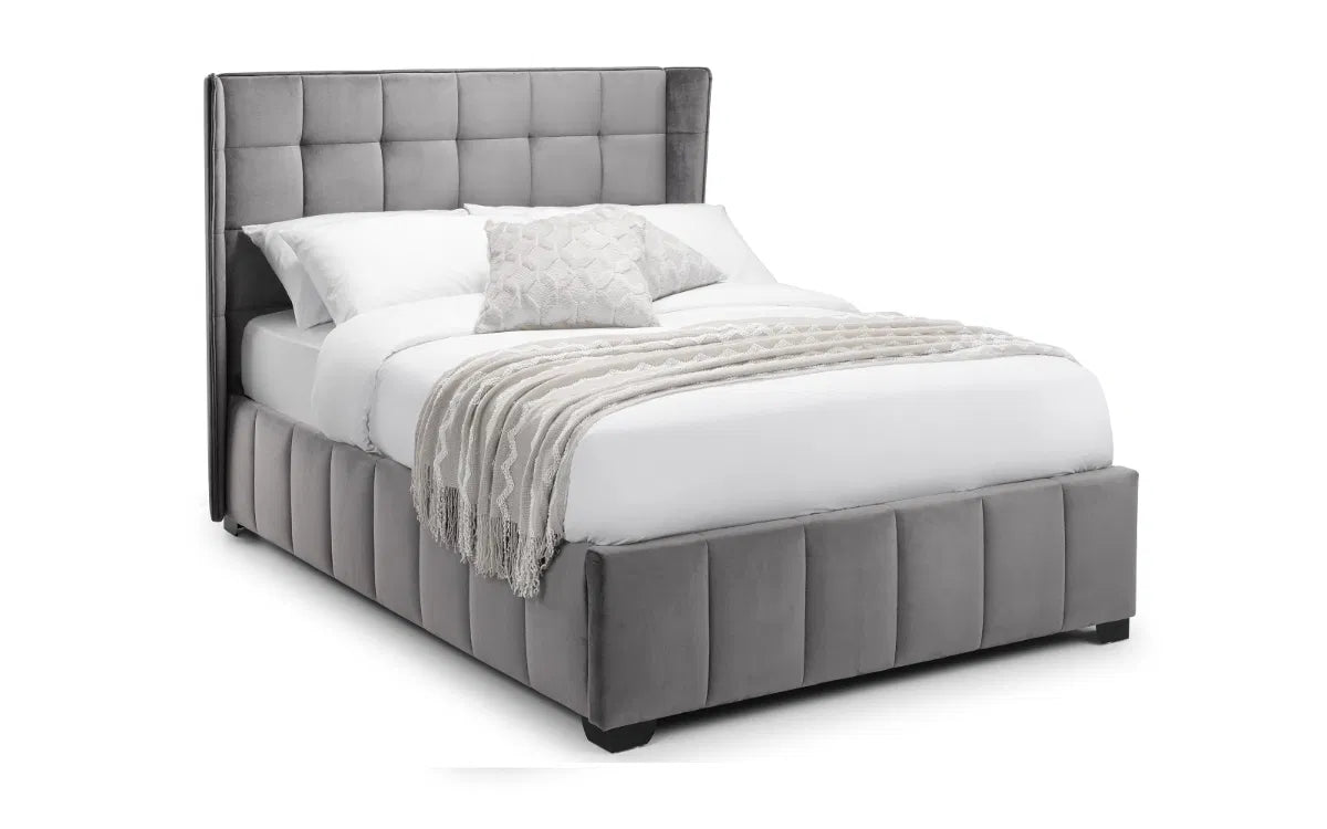 Gray upholstered bed with white bedding on a white background | Grey Velvet