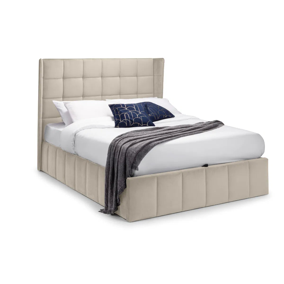 Beige upholstered bed with white bedding and a dark blue blanket on a white background | Cream Velvet