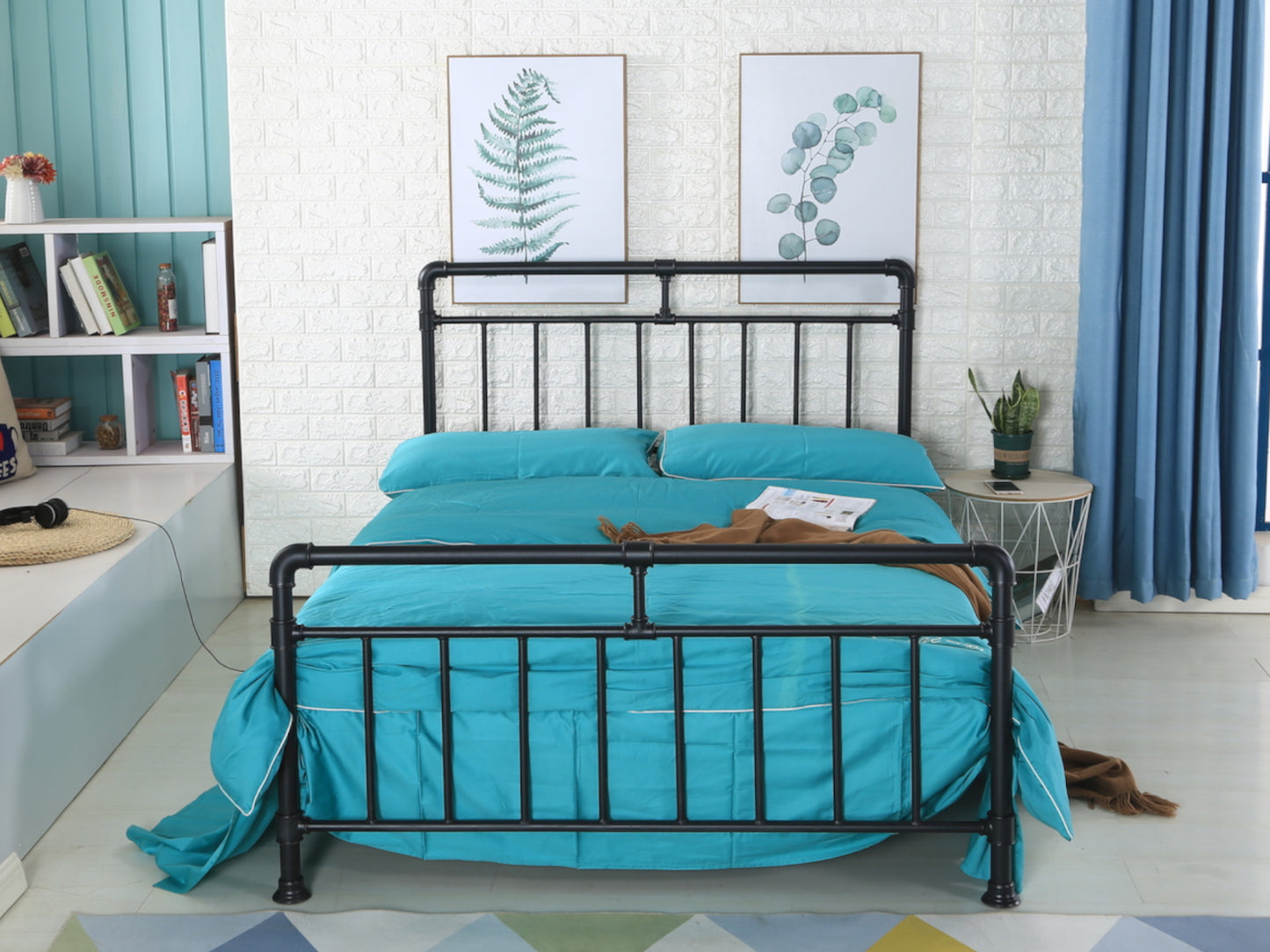 A black pipe industrial bed frame in a room with turquoise and yellow bedding, wooden slatted base, and a bookshelf in the background. | Black