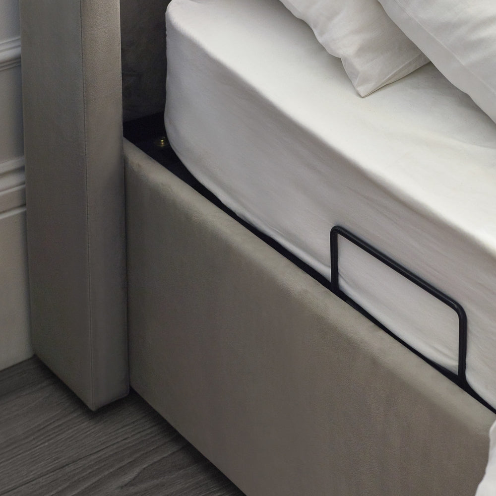 Close-up of a bed with a mattress and headboard in a neutral setting | Light Grey