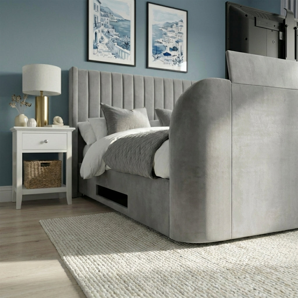 Gray upholstered bed in a bedroom with a nightstand and framed artwork on the wall | Light Grey