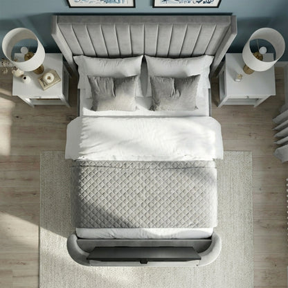 Top-down view of a neatly made bed with gray bedding in a bedroom setting | Light Grey