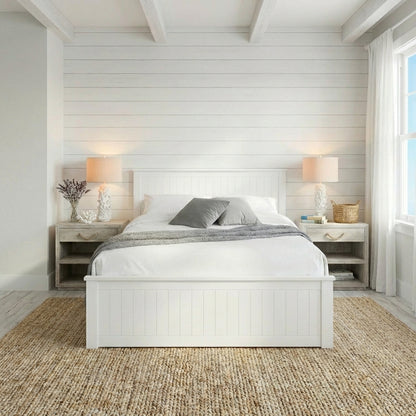 Bedroom with white bed, nightstands, and lamps in a room with wooden flooring and white walls | Surf White