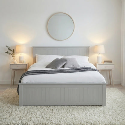 Gray bed with white bedding in a bedroom setting with lamps and decor | Dove Grey