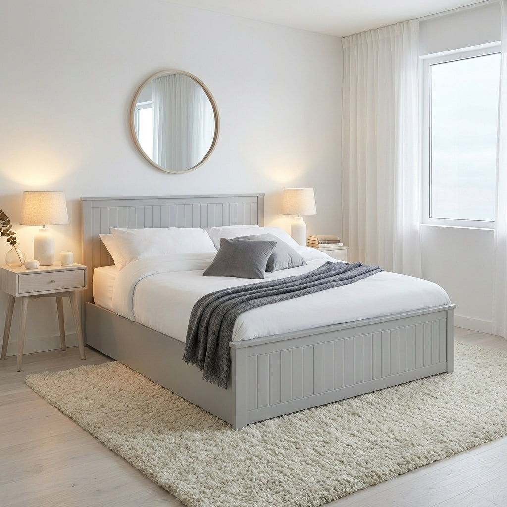 Neatly made bed with gray bedding in a bright bedroom | Dove Grey