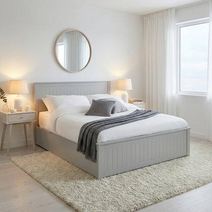 Neatly made bed with gray bedding in a bright bedroom | Dove Grey