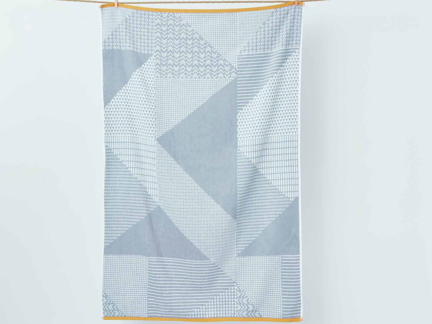 Catherine Lansfield Larsson Geo 100% Cotton Towels in Grey/Ochre